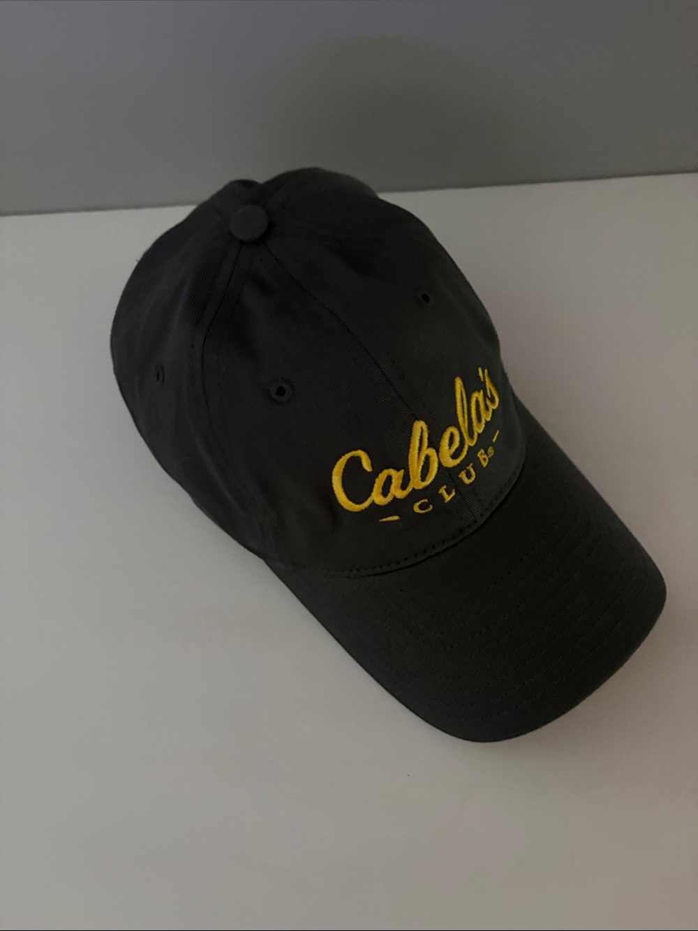 Cabela's Black Baseball Cap with Yellow Script Logo